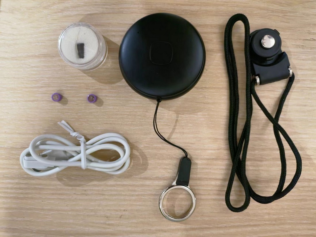 spion øretelefon med nøkkelring pakke inkluderer